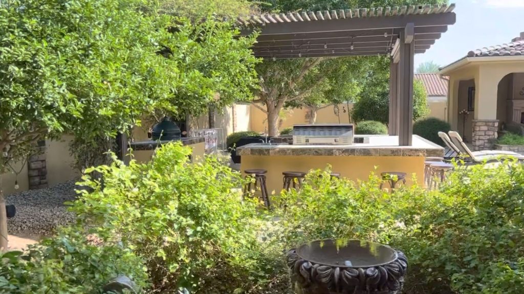 Surface-mount outdoor speaker covering an Arizona backyard kitchen and patio