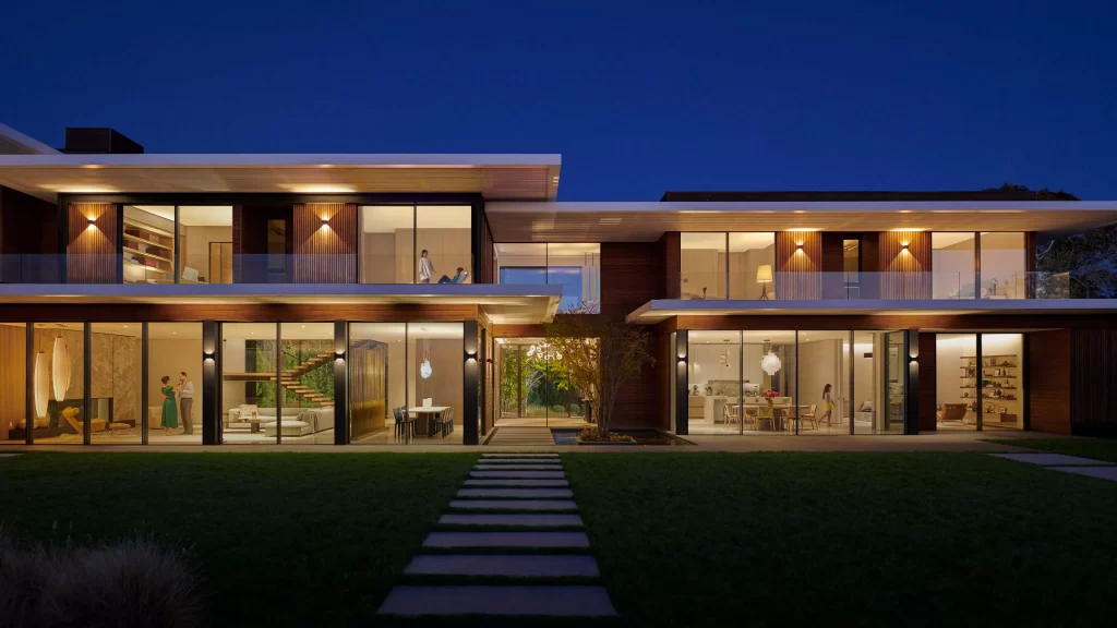 Modern residence illuminated by coordinated architectural lighting at dusk