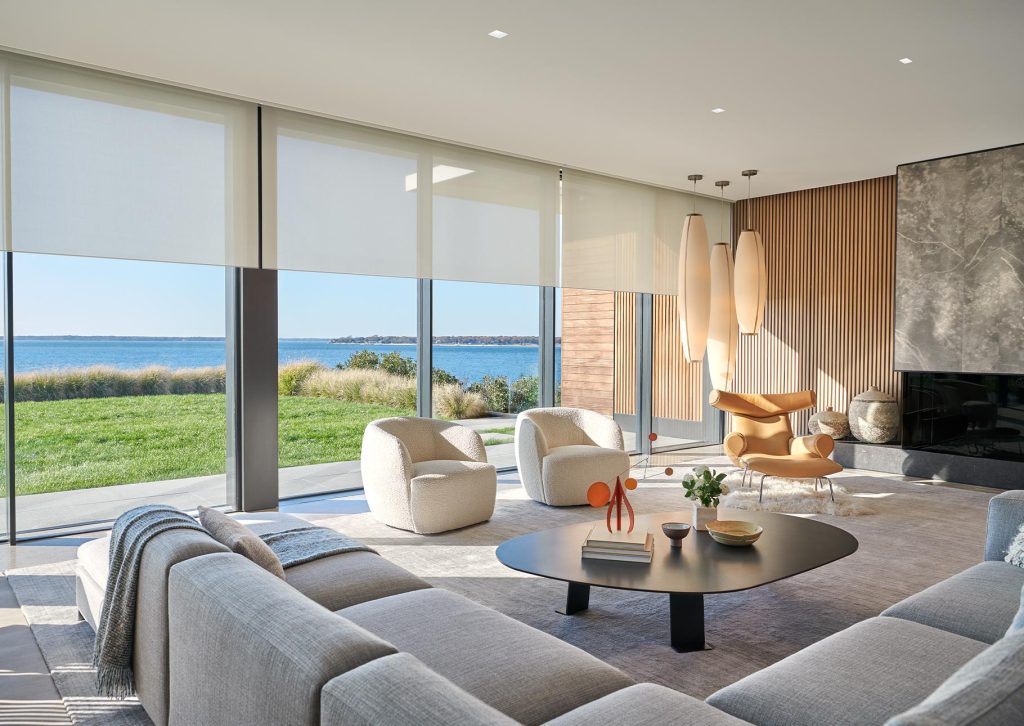 Automated shades managing daylight in a contemporary home