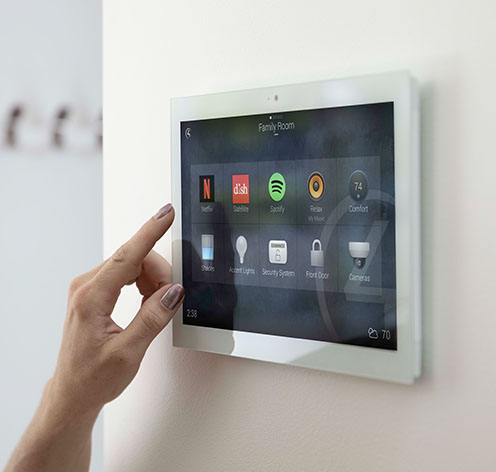 Hand using an integrated smart home touch panel