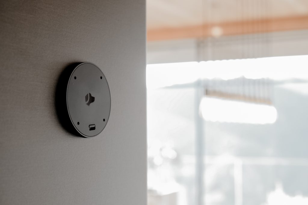 Josh Nano voice-control microphone discreetly installed on a finished wall.
