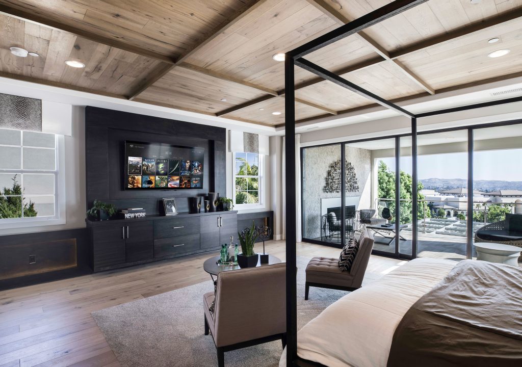 Luxury residence with integrated television, lighting, ceiling speakers and expansive glazing